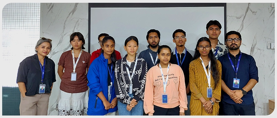 A group photograph of nine trainees and two instructors, standing in a row.